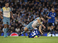 Nicolo Barella #23 of Inter Milan is tackled by Josko Gvardiol #24 of Manchester City F.C. during the UEFA Champions League League Stage mat...