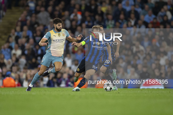 Nicolo Barella #23 of Inter Milan possesses the ball during the UEFA Champions League League Stage match between Manchester City and Footbal...