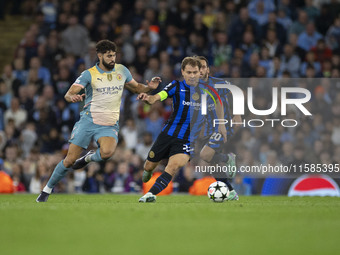 Nicolo Barella #23 of Inter Milan possesses the ball during the UEFA Champions League League Stage match between Manchester City and Footbal...