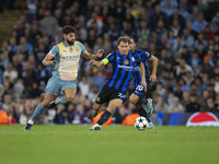 Nicolo Barella #23 of Inter Milan possesses the ball during the UEFA Champions League League Stage match between Manchester City and Footbal...