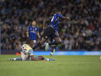 Marcus Thuram #9 of Inter Milan is fouled by Savinho #26 of Manchester City F.C. during the UEFA Champions League League Stage match between...