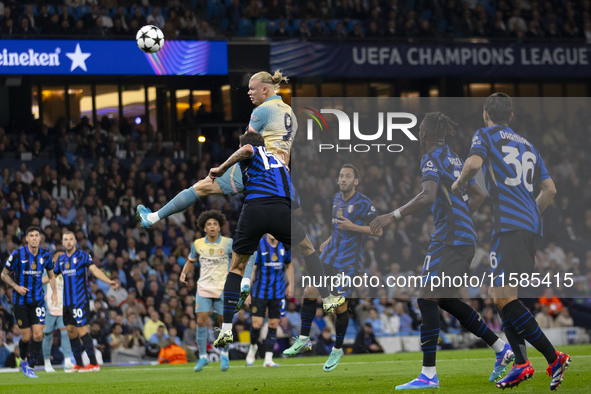 Erling Haaland #9 of Manchester City F.C. heads the ball during the UEFA Champions League League Stage match between Manchester City and Foo...