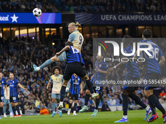 Erling Haaland #9 of Manchester City F.C. heads the ball during the UEFA Champions League League Stage match between Manchester City and Foo...