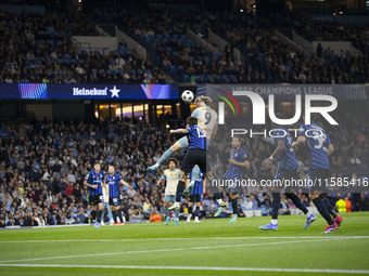 Erling Haaland #9 of Manchester City F.C. heads the ball during the UEFA Champions League League Stage match between Manchester City and Foo...