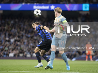 Nicolo Barella #23 of Inter Milan possesses the ball during the UEFA Champions League League Stage match between Manchester City and Footbal...