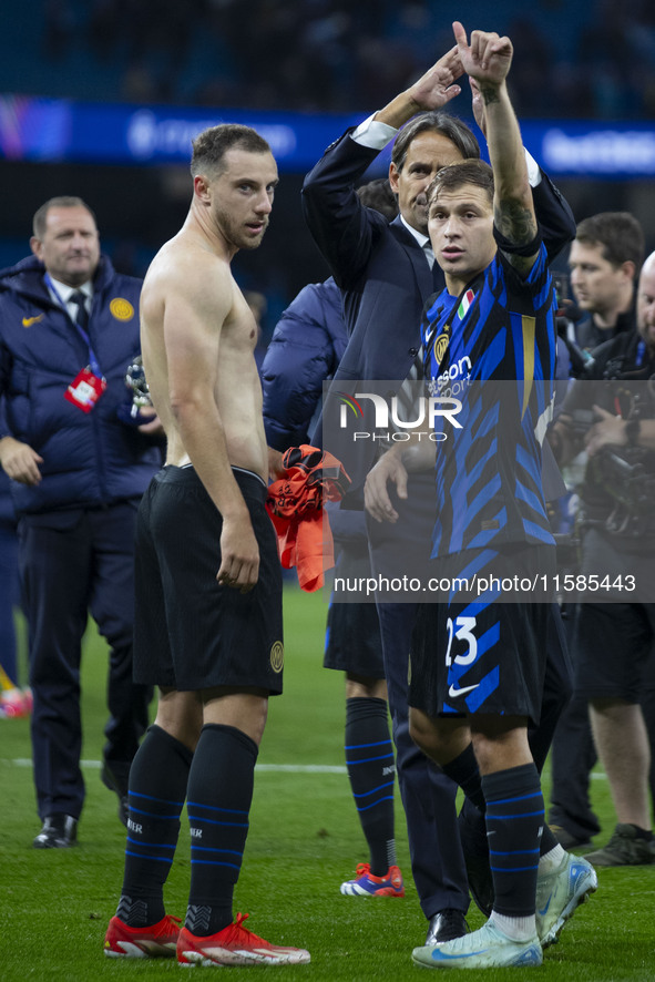 Nicolo Barella #23 of Inter Milan salutes the fans at full time during the UEFA Champions League League Stage match between Manchester City...