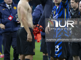 Nicolo Barella #23 of Inter Milan salutes the fans at full time during the UEFA Champions League League Stage match between Manchester City...