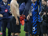 Nicolo Barella #23 of Inter Milan salutes the fans at full time during the UEFA Champions League League Stage match between Manchester City...