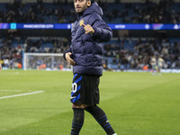 Hakan Calhanoglu #20 of Inter Milan salutes the fans at full time during the UEFA Champions League League Stage match between Manchester Cit...