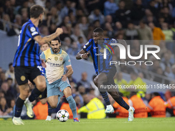 Marcus Thuram #9 of Inter Milan possesses the ball during the UEFA Champions League League Stage match between Manchester City and Football...