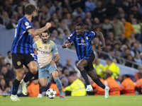 Marcus Thuram #9 of Inter Milan possesses the ball during the UEFA Champions League League Stage match between Manchester City and Football...