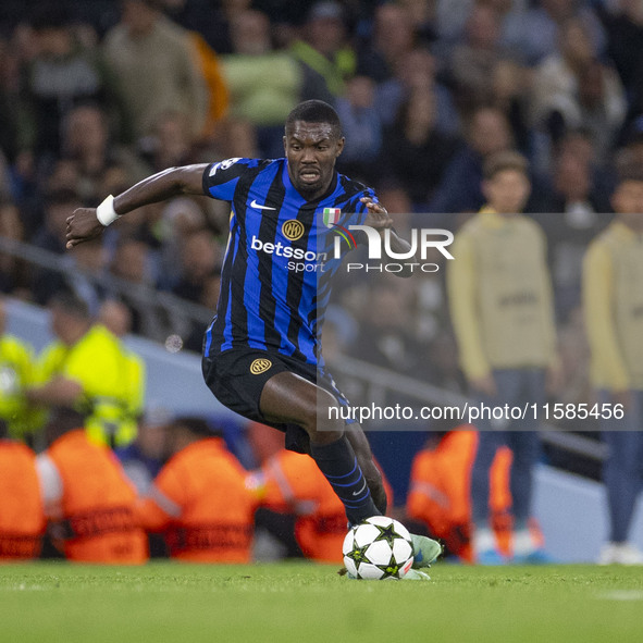 Marcus Thuram #9 of Inter Milan possesses the ball during the UEFA Champions League League Stage match between Manchester City and Football...