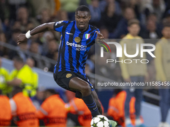 Marcus Thuram #9 of Inter Milan possesses the ball during the UEFA Champions League League Stage match between Manchester City and Football...