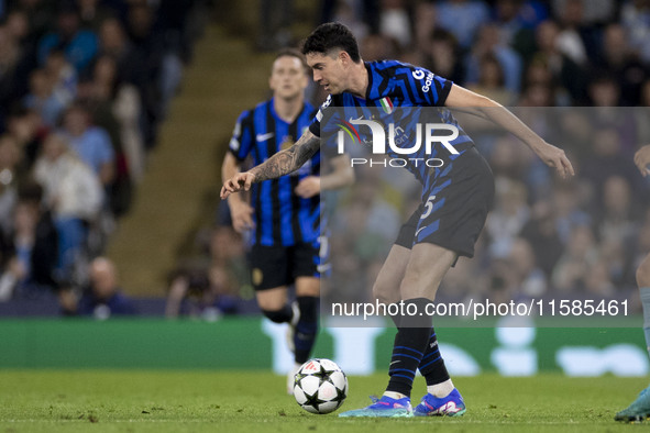 Alessandro Bastoni #95 of Inter Milan possesses the ball during the UEFA Champions League League Stage match between Manchester City and Foo...