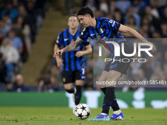 Alessandro Bastoni #95 of Inter Milan possesses the ball during the UEFA Champions League League Stage match between Manchester City and Foo...