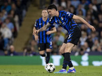 Alessandro Bastoni #95 of Inter Milan possesses the ball during the UEFA Champions League League Stage match between Manchester City and Foo...