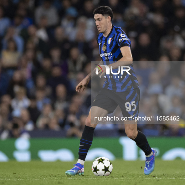 Alessandro Bastoni #95 of Inter Milan possesses the ball during the UEFA Champions League League Stage match between Manchester City and Foo...