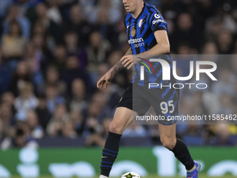 Alessandro Bastoni #95 of Inter Milan possesses the ball during the UEFA Champions League League Stage match between Manchester City and Foo...