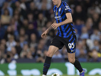 Alessandro Bastoni #95 of Inter Milan possesses the ball during the UEFA Champions League League Stage match between Manchester City and Foo...