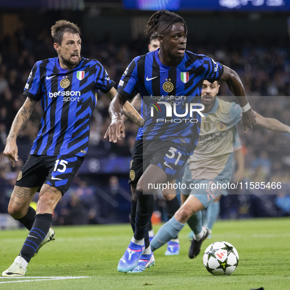 Yann Aurel Bisseck #31 of Inter Milan is in action during the UEFA Champions League League Stage match between Manchester City and Football...