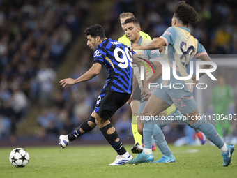 Mehdi Taremi #99 of Inter Milan is in action during the UEFA Champions League Group Stage match between Manchester City and Football Club In...