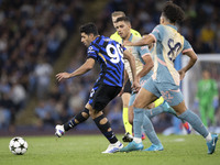 Mehdi Taremi #99 of Inter Milan is in action during the UEFA Champions League Group Stage match between Manchester City and Football Club In...