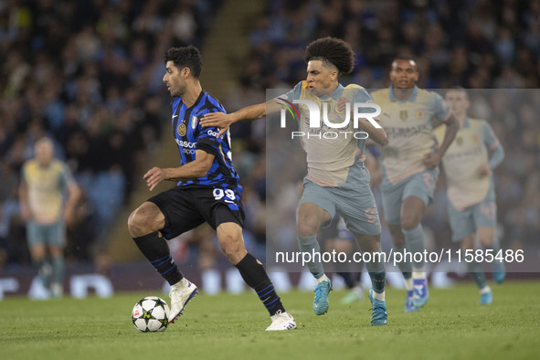 Mehdi Taremi #99 of Inter Milan is in action during the UEFA Champions League Group Stage match between Manchester City and Football Club In...