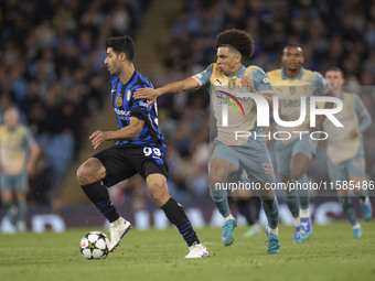 Mehdi Taremi #99 of Inter Milan is in action during the UEFA Champions League Group Stage match between Manchester City and Football Club In...