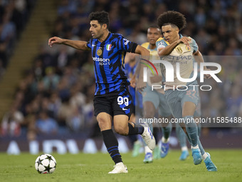 Mehdi Taremi #99 of Inter Milan is in action during the UEFA Champions League Group Stage match between Manchester City and Football Club In...