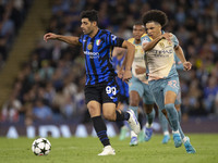 Mehdi Taremi #99 of Inter Milan is in action during the UEFA Champions League Group Stage match between Manchester City and Football Club In...