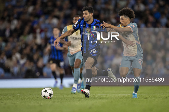 Mehdi Taremi #99 of Inter Milan is in action during the UEFA Champions League Group Stage match between Manchester City and Football Club In...