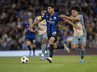 Mehdi Taremi #99 of Inter Milan is in action during the UEFA Champions League Group Stage match between Manchester City and Football Club In...