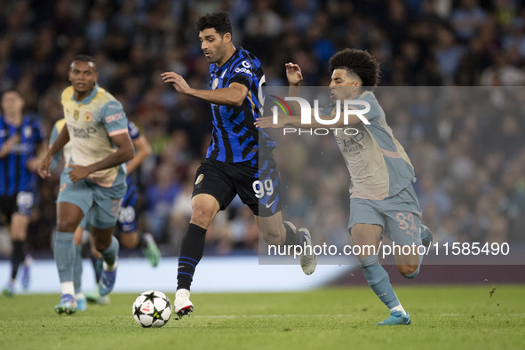 Mehdi Taremi #99 of Inter Milan is in action during the UEFA Champions League Group Stage match between Manchester City and Football Club In...