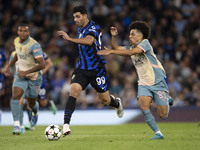 Mehdi Taremi #99 of Inter Milan is in action during the UEFA Champions League Group Stage match between Manchester City and Football Club In...