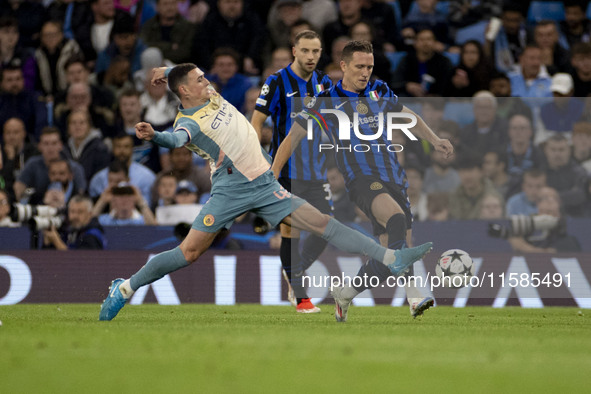 Phil Foden #47 of Manchester City F.C. tackles the opponent during the UEFA Champions League League Stage match between Manchester City and...