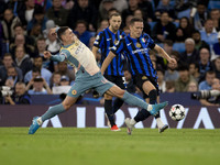 Phil Foden #47 of Manchester City F.C. tackles the opponent during the UEFA Champions League League Stage match between Manchester City and...