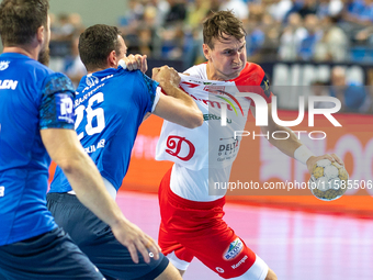 Przemyslaw Krajewski and Stanislav Kasparek are playing during the  EHF Champions League Men match between  Orlen Wisla Plock and Dinamo Buc...