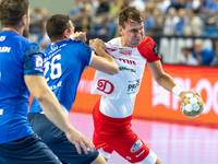 Przemyslaw Krajewski and Stanislav Kasparek are playing during the  EHF Champions League Men match between  Orlen Wisla Plock and Dinamo Buc...