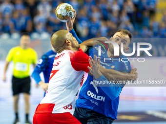 Andre Gomes and Zoltan Szita are playing during the  EHF Champions League Men match between  Orlen Wisla Plock and Dinamo Bucuresti in Plock...