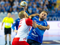 Andre Gomes and Zoltan Szita are playing during the  EHF Champions League Men match between  Orlen Wisla Plock and Dinamo Bucuresti in Plock...