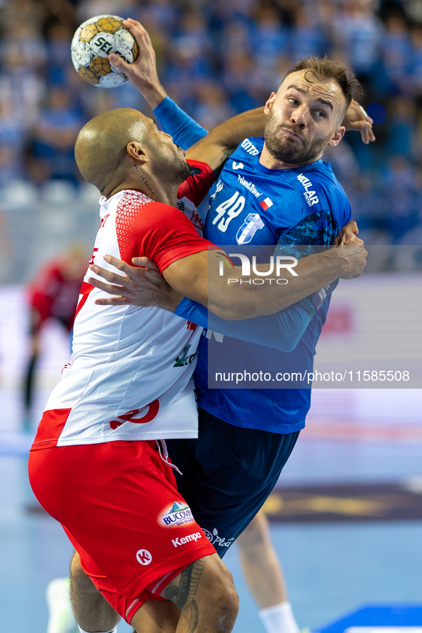 Andre Gomes and  Zoltan Szita  are playing during the  EHF Champions League Men match between  Orlen Wisla Plock and Dinamo Bucuresti in Plo...