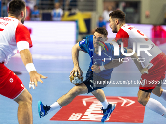 Mitja Janc and  Robert Mihai Militaru  are playing during the  EHF Champions League Men match between  Orlen Wisla Plock and Dinamo Bucurest...