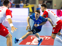 Mitja Janc and  Robert Mihai Militaru  are playing during the  EHF Champions League Men match between  Orlen Wisla Plock and Dinamo Bucurest...