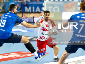 Leon Susnja and  Yoav Lumbroso are  playing during the  EHF Champions League Men match between  Orlen Wisla Plock and Dinamo Bucuresti in Pl...