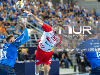 Leon Susnja and  Haniel Vinicius Inoue Langaro are playing during the  EHF Champions League Men match between  Orlen Wisla Plock and Dinamo...