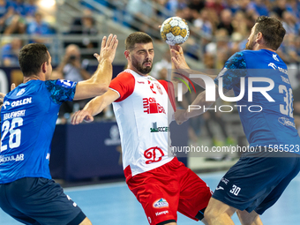 Przemyslaw Krajewski, Branko Vujovic and Mirsad Terzic are playing during the  EHF Champions League Men match between  Orlen Wisla Plock and...