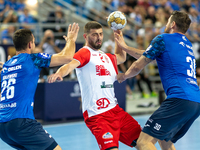 Przemyslaw Krajewski, Branko Vujovic and Mirsad Terzic are playing during the  EHF Champions League Men match between  Orlen Wisla Plock and...