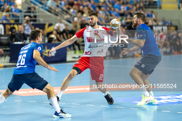 Przemyslaw Krajewski, Branko Vujovic and Mirsad Terzic are  playing during the  EHF Champions League Men match between  Orlen Wisla Plock an...