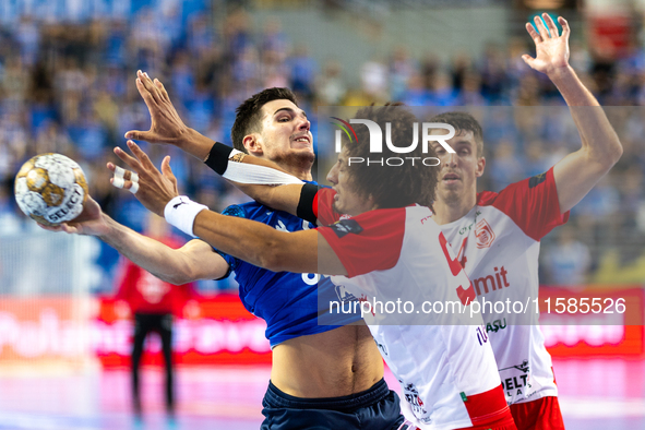 Gergo Fazekas and Ali Ismail Mohamed Zeinelabedin Ali are playing during the  EHF Champions League Men match between  Orlen Wisla Plock and...