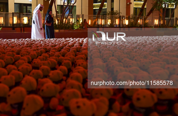 People visit the installation of teddy bears titled ''Echo of Lost Innocence'' at the Barahat Mashaireb open-air gallery to draw attention t...